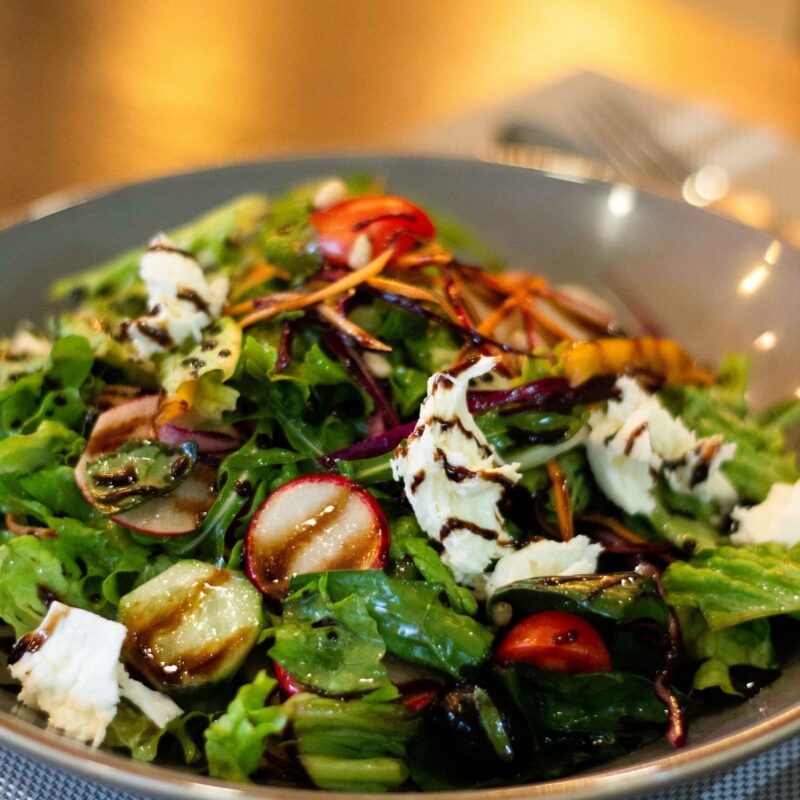 Close up of a salad with balsomic drizzle